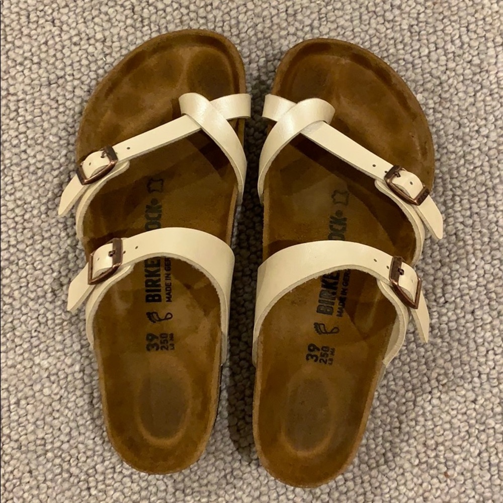 Pearl colored Birkenstock sandals with toe strap